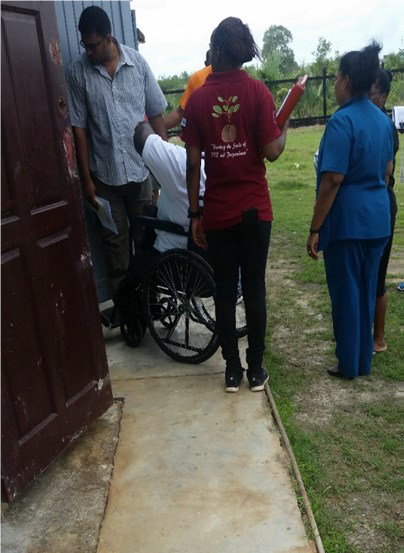 NCD’s Commissioner Hilton Morris testing ramp & toilet are on Feb. 14th , 2018 at Fort Ordnance Primary School